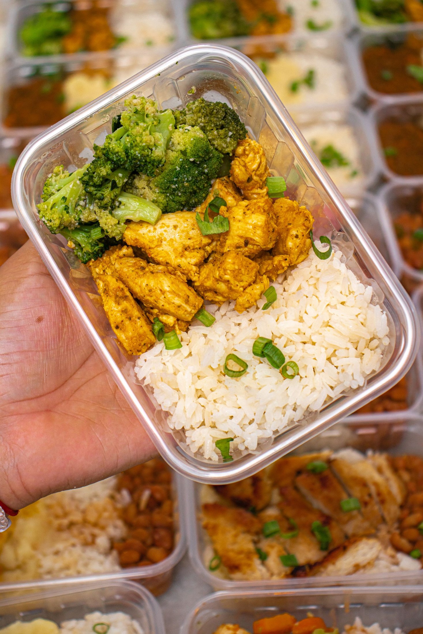 Meal-prep container with chicken, broccoli and rice.